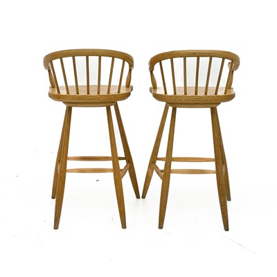 Lot 1830 - A pair of beech high stools with horseshoe backs.