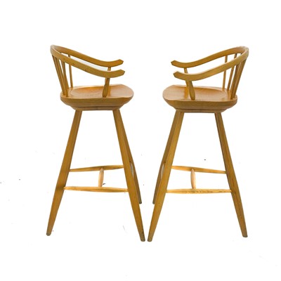 Lot 1830 - A pair of beech high stools with horseshoe backs.