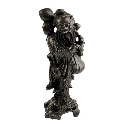 Lot 256 - A Chinese carved root wood figure of an Imortal, circa 1900.