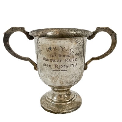 Lot 137 - A white metal twin handled trophy cup.