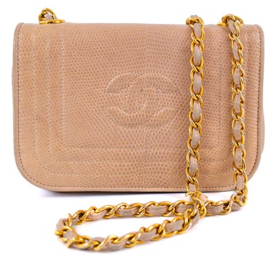 Lot 121 - A Chanel beige lizard mini flap CC shoulder bag.