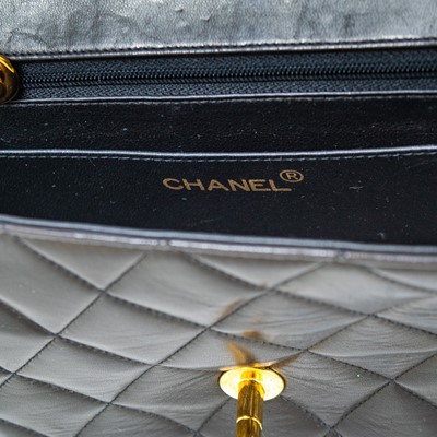 Lot 128 - A Chanel black lambskin leather mini Diana bag.