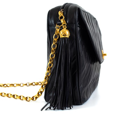 Lot 148 - A Chanel black lambskin leather chevron camera bag.