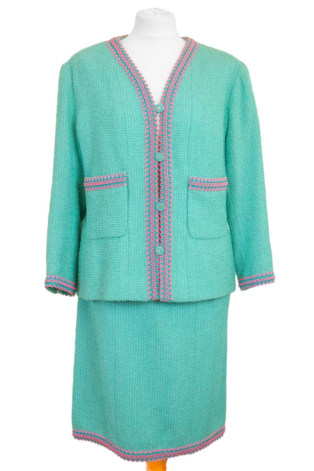 Lot 138 - A Chanel Boutique turquoise Scoubidou 1994 collection dress suit with braided trim.