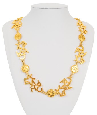 Lot 126 - A Chanel 1980's gold-tone logo and CC medallion long necklace.