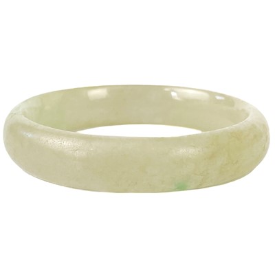 Lot 449 - A Chinese celadon jade bangle.