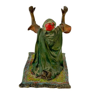 Lot 130 - An Austrian cold painted bronze of an Arab praying.