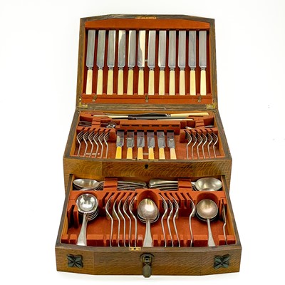 Lot 214 - An Art Deco oak cased part canteen of cutlery.