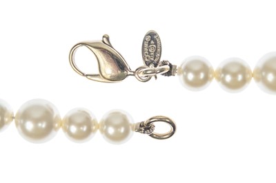 Lot 576 - A Chanel faux pearl and gold-tone CC crystal set necklace.