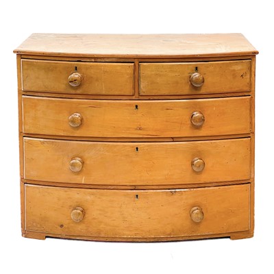 Lot 208 - A 19th century pine bow fronted chest of drawers.