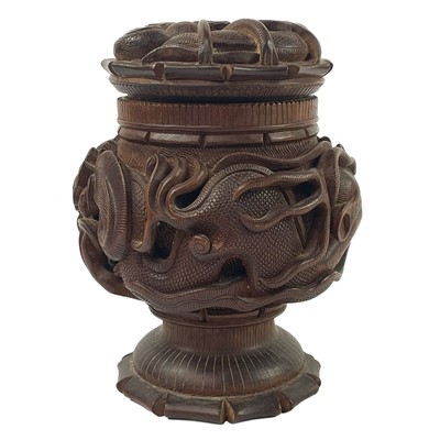 Lot 28 - Ghurkha interest, A Nepalese carved teak tobacco jar and cover.