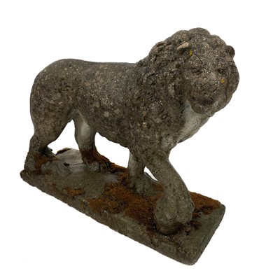 Lot 1003 - A reconstituted stone lion figure.