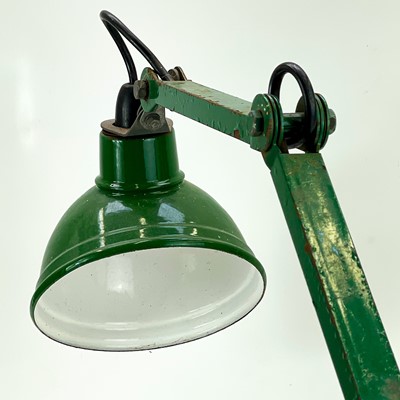 Lot 144 - An industrial adjustable lamp.