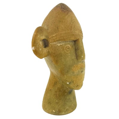 Lot 125 - A carved soapstone tribal head.