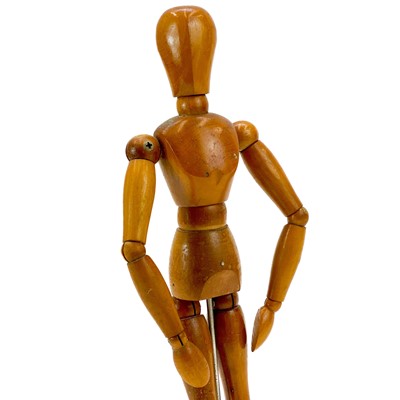 Lot 126 - A wooded articulated artists mannequin.