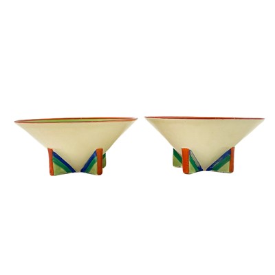 Lot 558 - A pair of Clarice Cliff banded ware pattern candle holder shape 384.