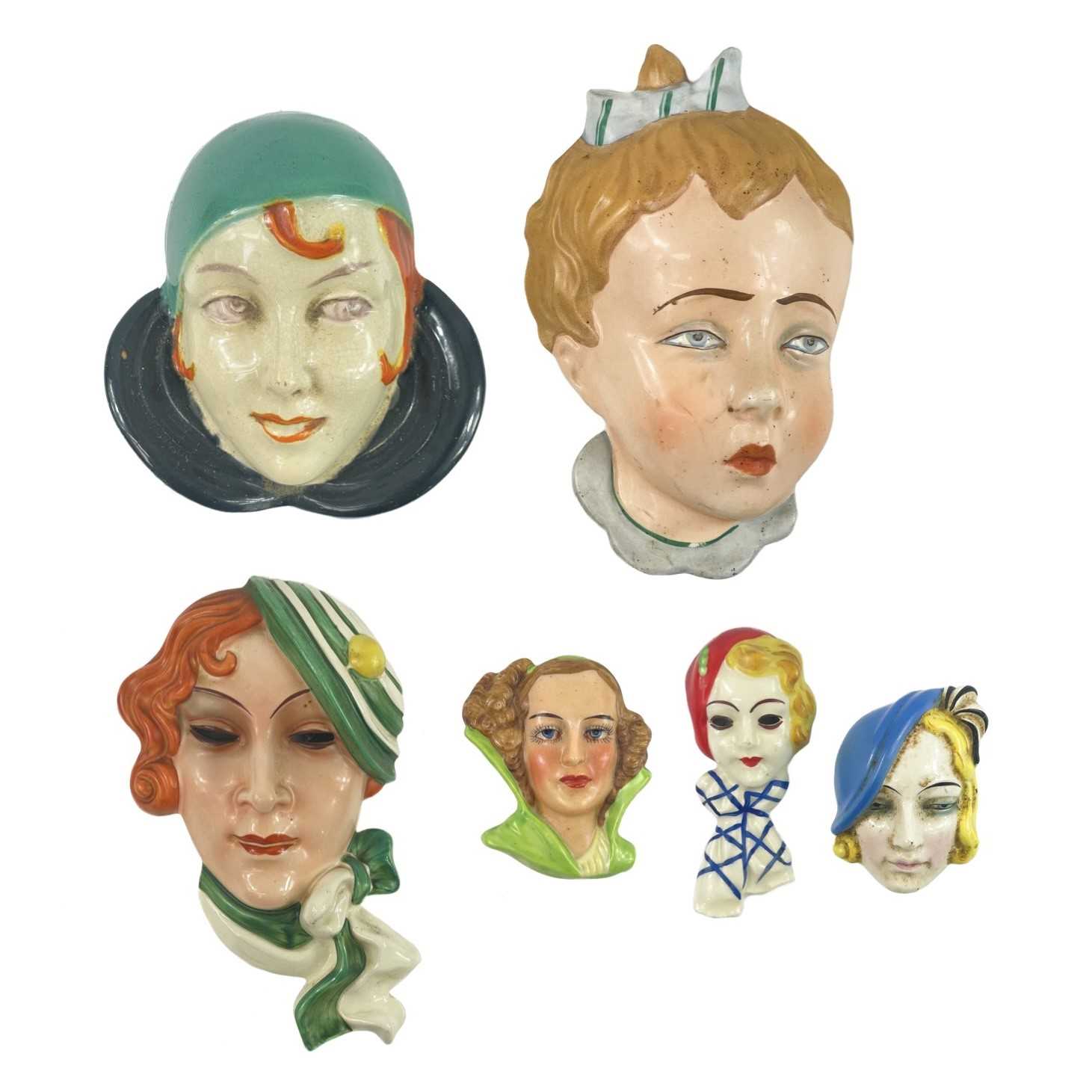 Lot 908 - A group of six Czech and other Art Deco face masks.