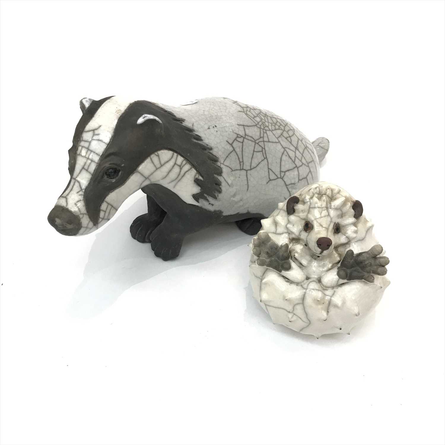 Lot 1473 - A Brian Andrew raku pottery badger and hedghog,...