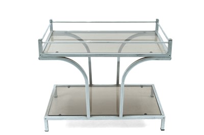 Lot 423 - A chrome and smoked glass two tier table.