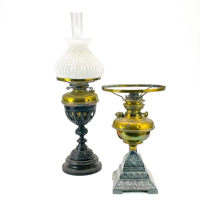 Lot 184 - A Victorian cast iron and brass oil lamp with a white opaque glass shade.