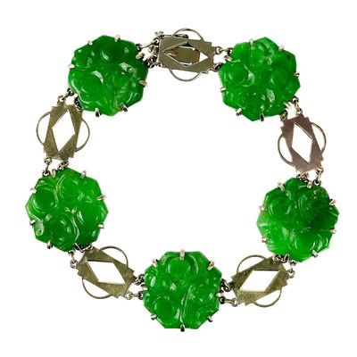 Lot 69 - An Art Deco 9ct white gold and green jade panel bracelet.