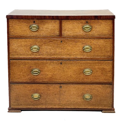 Lot 86 - A late George III oak chest.