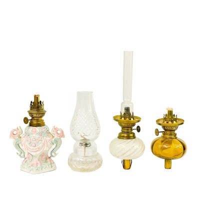 Lot 186 - A small Victorian brass peg oil lamp with glass reservoir.