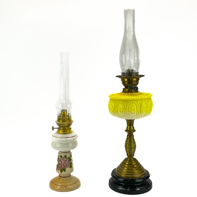 Lot 189 - A Victorian brass oil lamp with yellow glass reservoir.