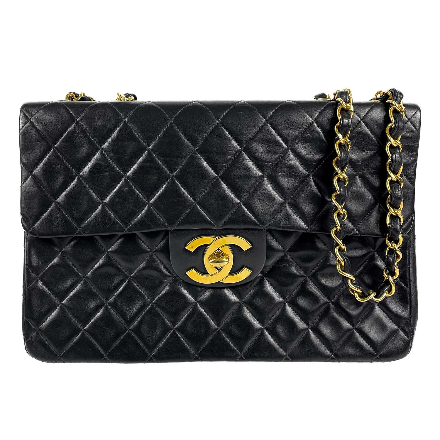 Lot 125 - A Chanel black lambskin jumbo maxi single flap bag.