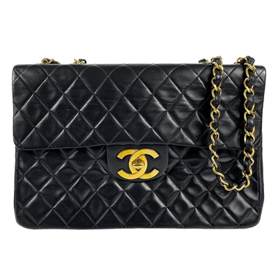 Lot 125A - A Chanel black lambskin jumbo maxi single flap bag.