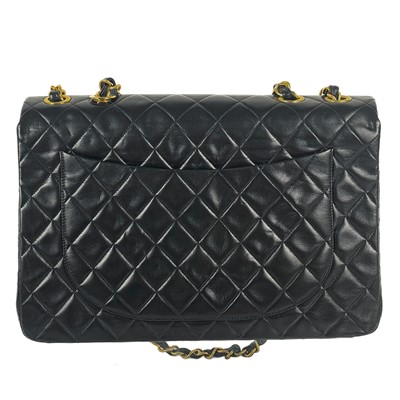 Lot 125 - A Chanel black lambskin jumbo maxi single flap bag.