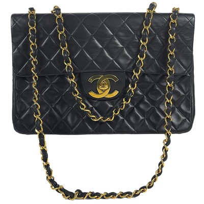 Lot 125 - A Chanel black lambskin jumbo maxi single flap bag.