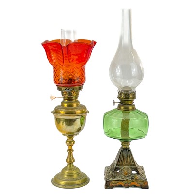 Lot 193 - A Victorian brass oil lamp with orange glass shade.