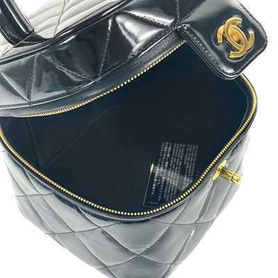 Lot 18 - A Chanel Matelasse patent black leather CC vanity bag.