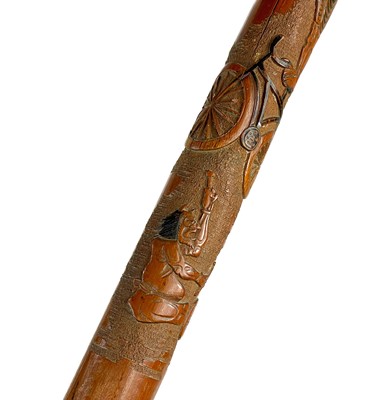 Lot 384 - A Japanese carved bamboo walking cane, early-mid 20th century.