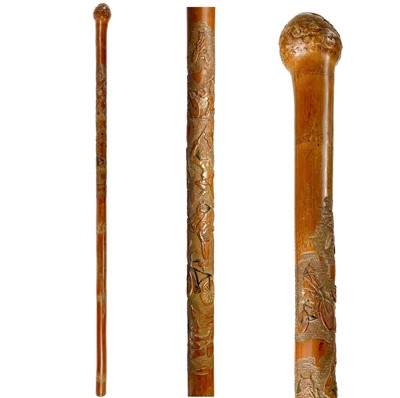 Lot 384 - A Japanese carved bamboo walking cane, early-mid 20th century.