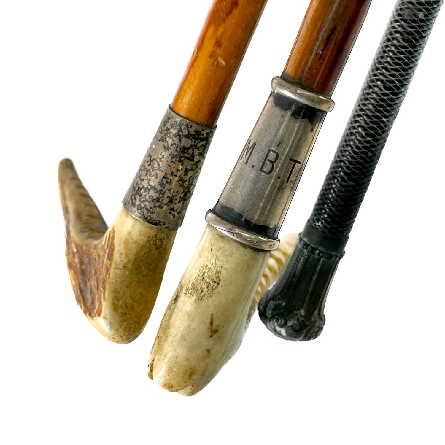 Lot 211 - A silver and horn mounted riding crop.