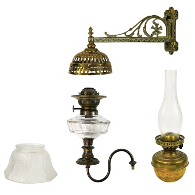 Lot 204 - A Victorian brass wall mounted brass oil lamp.