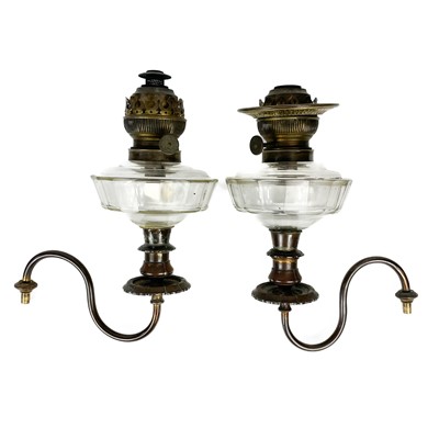 Lot 38 - A Victorian wall mounted brass oil lamp.