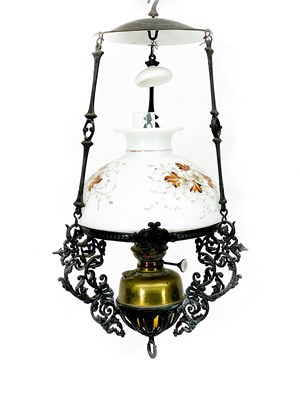 Lot 230 - A Victorian cast iron hanging oil lamp.