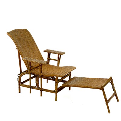 Lot 1802 - A bamboo and rattan plantation type steamer chair and footrest.