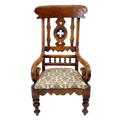 Lot 1945 - A late Victorian walnut open armchair.