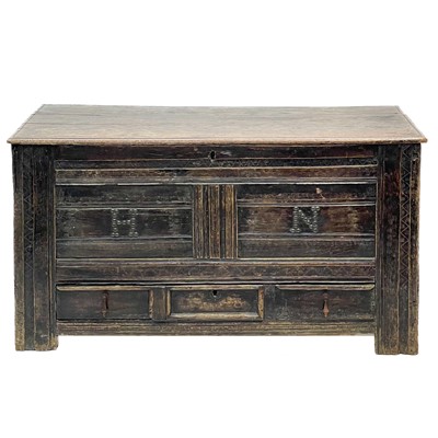 Lot 105 - An 18th century oak mule chest.