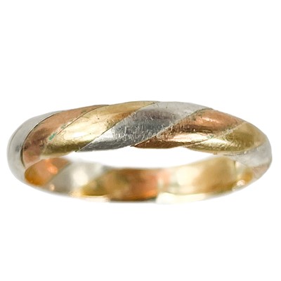 Lot 75 - A modern 9ct tri-colour gold band ring.