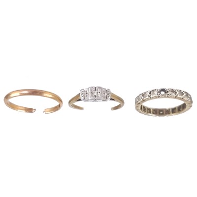 Lot 94 - Two broken gold rings and a white gold stone set eternity ring.