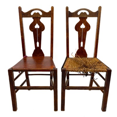 Lot 1951 - A pair of Arts and Crafts oak side chairs.