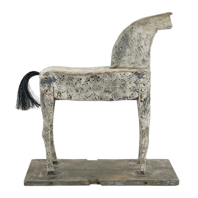 Lot 131 - A naive painted toy horse.