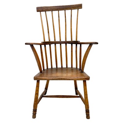 Lot 166 - A 19th century elm and fruitwood West Country comb back Windsor armchair.