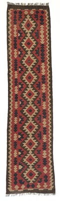 Lot 22 - A Persian kelim runner, mid-late 20th century.