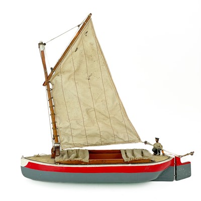 Lot 200 - A painted model of a sailing boat.